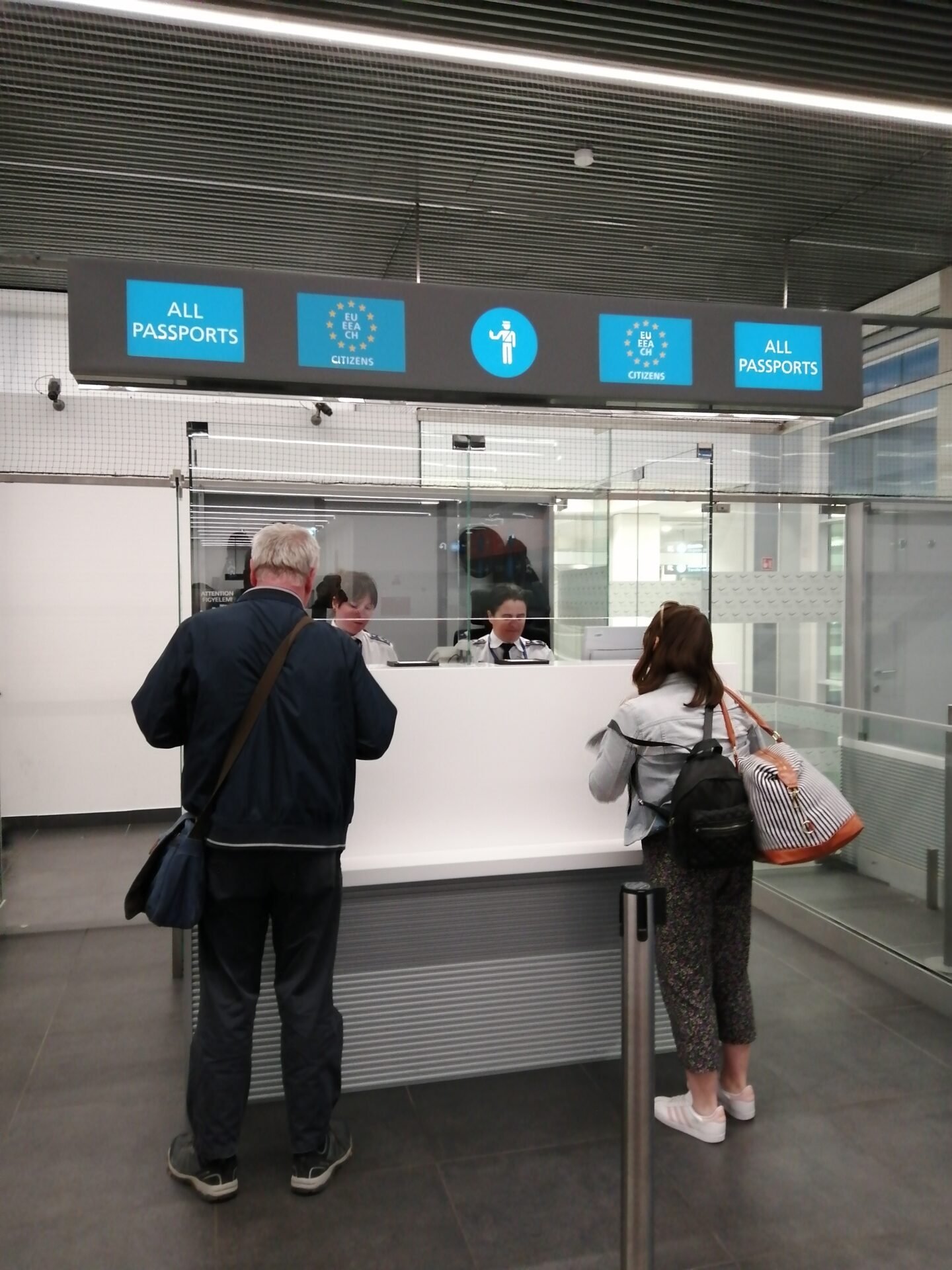 Passport control at Budapest Airport showing an international arrivals checkpoint